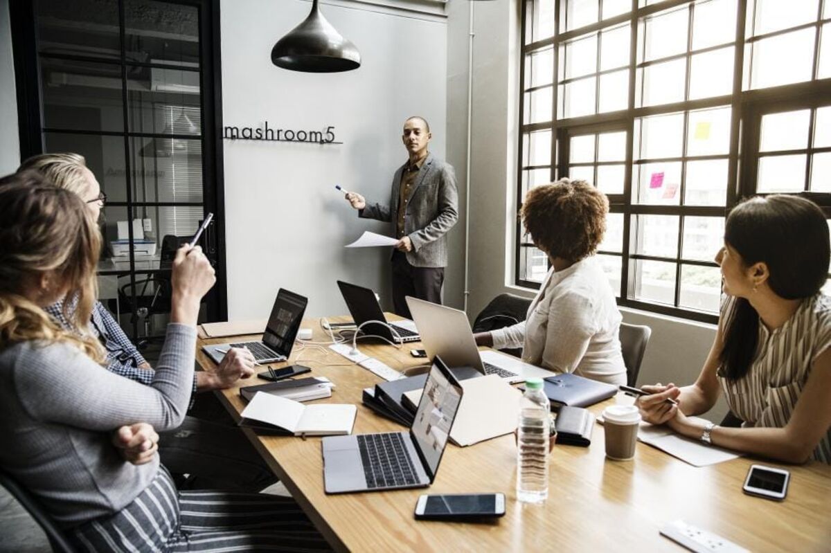 A small business team working together in a bright office